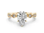 Pear Cut Diamond Solitaire Engagement Ring Set in Yellow gold with Milgrain Bezel Accent Band