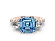 Fancy Blue Three-Stone Asscher Cut Diamond Pavé Band Ring Set in Rose gold with Prong-Set Trio