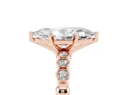 Marquise Cut Diamond Solitaire Engagement Ring Set in Rose gold with Bezel Accents on Beaded Band