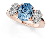 Fancy Blue Oval Cut Diamond Three-Stone Ring Set in Rose gold with Polished Band and Prong Setting