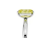Fancy Yellow Emerald Cut Diamond Solitaire Ring Set in White gold with Prong Setting on a Polished Plain Band
