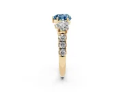 Fancy Blue Heart Cut Diamond Three-Stone Ring Set in Yellow gold with Pavé Band