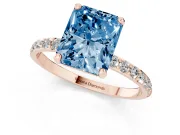 Fancy Blue Radiant Cut Diamond Solitaire Ring Set in Rose gold with Round Pavé Band and Prong Setting