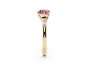 Fancy Pink Heart Cut Diamond Solitaire Ring Set in Yellow gold with Tapered Baguette Side Stones and Prong Setting