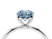 Fancy Blue Oval Cut Diamond Solitaire Engagement Ring Set in Silver with Thin Band and Prong Setting