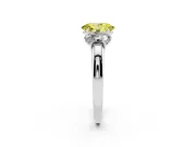 Fancy Yellow Oval Cut Diamond Three-Stone Ring Set in Platinum with Bold Center and Classic Band