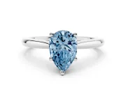 Fancy Blue Pear Cut Diamond Solitaire Ring Set in Platinum with Cathedral Band and Prong Setting