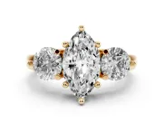 Marquise Cut Diamond Three-Stone Ring Set in Yellow gold with Prong Setting and Classic Band