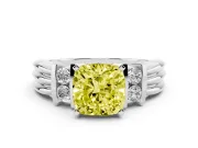 Fancy Yellow Three-Stone Cushion Cut Diamond Channel Set Ring Set in White gold with Bar Prongs
