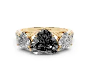 Fancy Black Heart Cut Diamond Three-Stone Ring Set in Yellow gold with Pavé Band