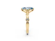 Fancy Blue Marquise Cut Diamond Solitaire Twisted Band Ring Set in Yellow gold with Accent Stones and Prong Setting