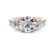 Round Cut Diamond Three-Stone Ring Set in Rose gold with Pavé Band and Graduated Sides