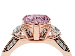 Fancy Pink Heart Cut Diamond Three-Stone Ring Set in Rose gold with Pavé Band and Smaller Side Stones