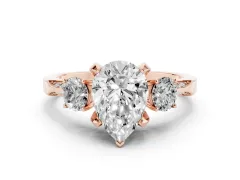Pear Cut Diamond Three-Stone Ring Set in Rose gold with Pavé Band and Smaller Side Stones