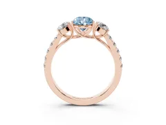 Fancy Blue Pear Cut Diamond Three-Stone Ring Set in Rose gold with Round Side Stones and Delicate Pavé Band