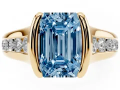 Fancy Blue Emerald Cut Diamond Bezel-Set Solitaire Ring Set in Yellow gold with Channel-Set Band