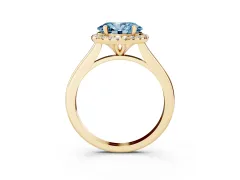Fancy Blue Oval Cut Diamond Halo Engagement Ring Set in Yellow gold with Pavé Band and Rising Shoulders