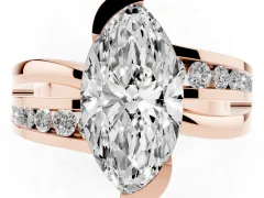 Marquise Cut Diamond Solitaire Ring Set in Rose gold with Channel Set Split Shank and Tension Prongs