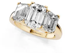 Emerald Cut Diamond Three-Stone Ring Set in Yellow gold with Channel-Set Band and Prong Settings