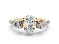 Pear Cut Diamond Three-Stone Ring Set in Yellow gold with Round Side Stones and Delicate Pavé Band