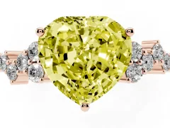 Fancy Yellow Heart Cut Diamond Ring Set in Rose gold with Scattered Round Accents