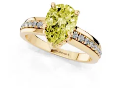 Fancy Yellow Pear Cut Diamond Solitaire Ring Set in Yellow gold with Channel Set Band and Prong Setting