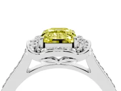 Fancy Yellow Emerald Cut Diamond Halo Ring Set in Platinum with Pavé-Lined Shoulders and Prong Setting