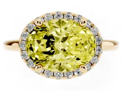 Fancy Yellow Oval Cut Diamond Halo Engagement Ring Set in Yellow gold with Pavé Band and Rising Shoulders