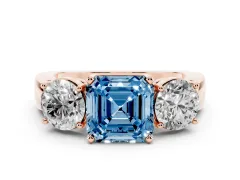 Fancy Blue Asscher Cut Diamond Three-Stone Ring Set in Rose gold with Round Side Stones and Classic Band