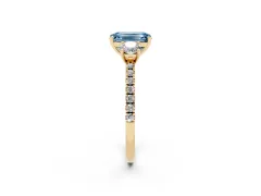 Fancy Blue Emerald Cut Diamond Three-Stone Ring Set in Yellow gold with Pavé Band and Graduated Sides