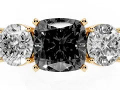 Fancy Black Cushion Cut Diamond Three-Stone Ring Set in Yellow gold with Round Side Stones and Classic Band