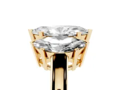 Marquise Cut Diamond Three-Stone Ring Set in Yellow gold with Channel-Set Band and Prong Settings