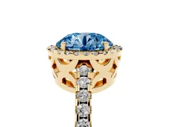 Fancy Blue Round Cut Diamond Halo Ring Set in Yellow gold with Pavé Shoulders and Halo-Framed Center