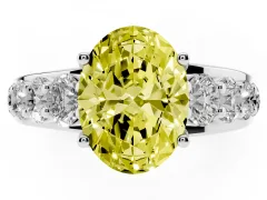Fancy Yellow Oval Cut Diamond Pavé Engagement Ring Set in White gold with Prong Setting