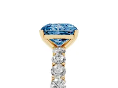 Fancy Blue Radiant Cut Diamond Solitaire Ring Set in Yellow gold with Shared Prong Pavé Band