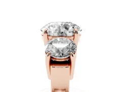 Round Cut Diamond Three-Stone Ring Set in Rose gold with Round Accent Stones and Plain Band