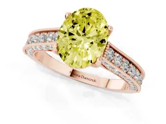 Fancy Yellow Oval Cut Diamond Solitaire Ring Set in Rose gold with Milgrain-Edged Pavé Band and Prong Setting