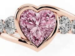 Fancy Pink Heart Cut Diamond Bezel Bypass Ring Set in Rose gold with Round Accents