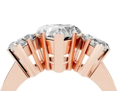 Heart Cut Diamond Three-Stone Ring Set in Rose gold with Channel-Set Band and Prong Settings