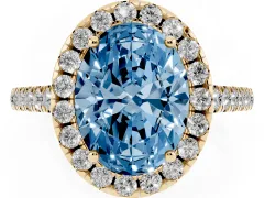 Fancy Blue Oval Cut Diamond Pavé Halo Engagement Ring Set in Yellow gold with Pavé Band and Prong Setting