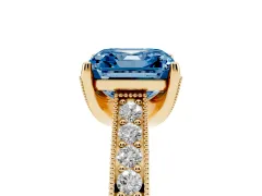 Fancy Blue Asscher Cut Diamond Solitaire Ring Set in Yellow gold with Milgrain-Edged Pavé Band and Prong Setting