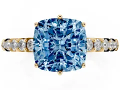 Fancy Blue Cushion Cut Diamond Solitaire Engagement Ring Set in Yellow gold with Pavé Band and Prong Setting