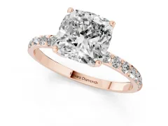 Cushion Cut Diamond Solitaire Engagement Ring Set in Rose gold with Round Pavé Band and Prong Setting