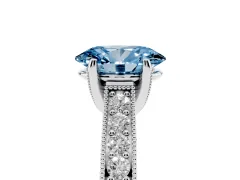 Fancy Blue Oval Cut Diamond Solitaire Ring Set in White gold with Milgrain-Edged Pavé Band and Prong Setting