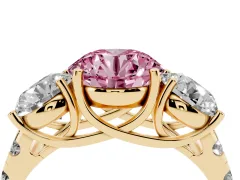 Fancy Pink Round Cut Diamond Three-Stone Ring Set in Yellow gold with Pavé Band