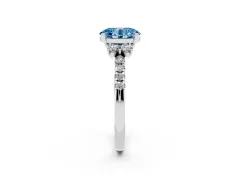 Fancy Blue Oval Cut Diamond Three-Stone Pavé Ring Set in Platinum with Prong Setting