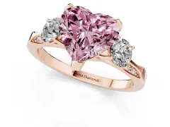 Fancy Pink Heart Cut Diamond Three-Stone Ring Set in Rose gold with Pavé Band and Smaller Side Stones