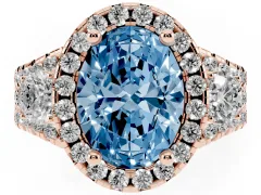 Fancy Blue Oval Cut Diamond Halo Split Shank Ring Set in Rose gold with Round Accent Stones and Prong Setting