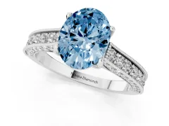 Fancy Blue Oval Cut Diamond Solitaire Ring Set in Platinum with Milgrain-Edged Pavé Band and Prong Setting
