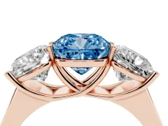 Fancy Blue Cushion Cut Diamond Three-Stone Ring Set in Rose gold with Plain Polished Band